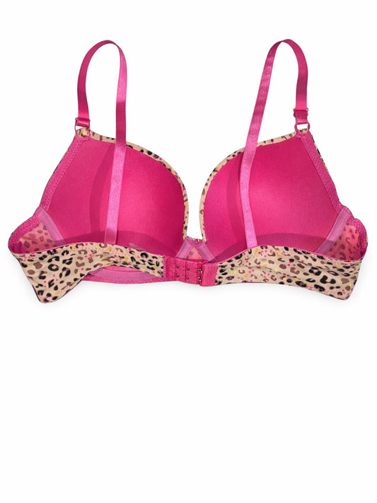 Pink bra with leopard print trim on a white background