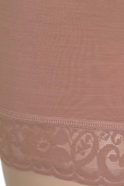 Close-up of a sheer beige panty leg cover with a floral lace trim at the bottom.