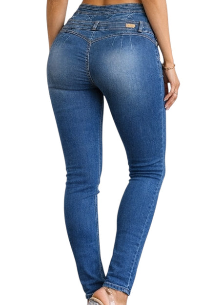 Blue jeans worn by a person on a white background