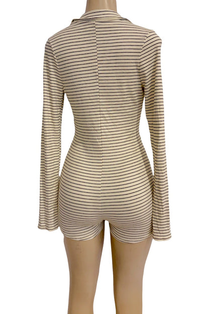 A cream and black horizontally striped long-sleeve romper displayed on a mannequin from the back view, set against a plain white background.