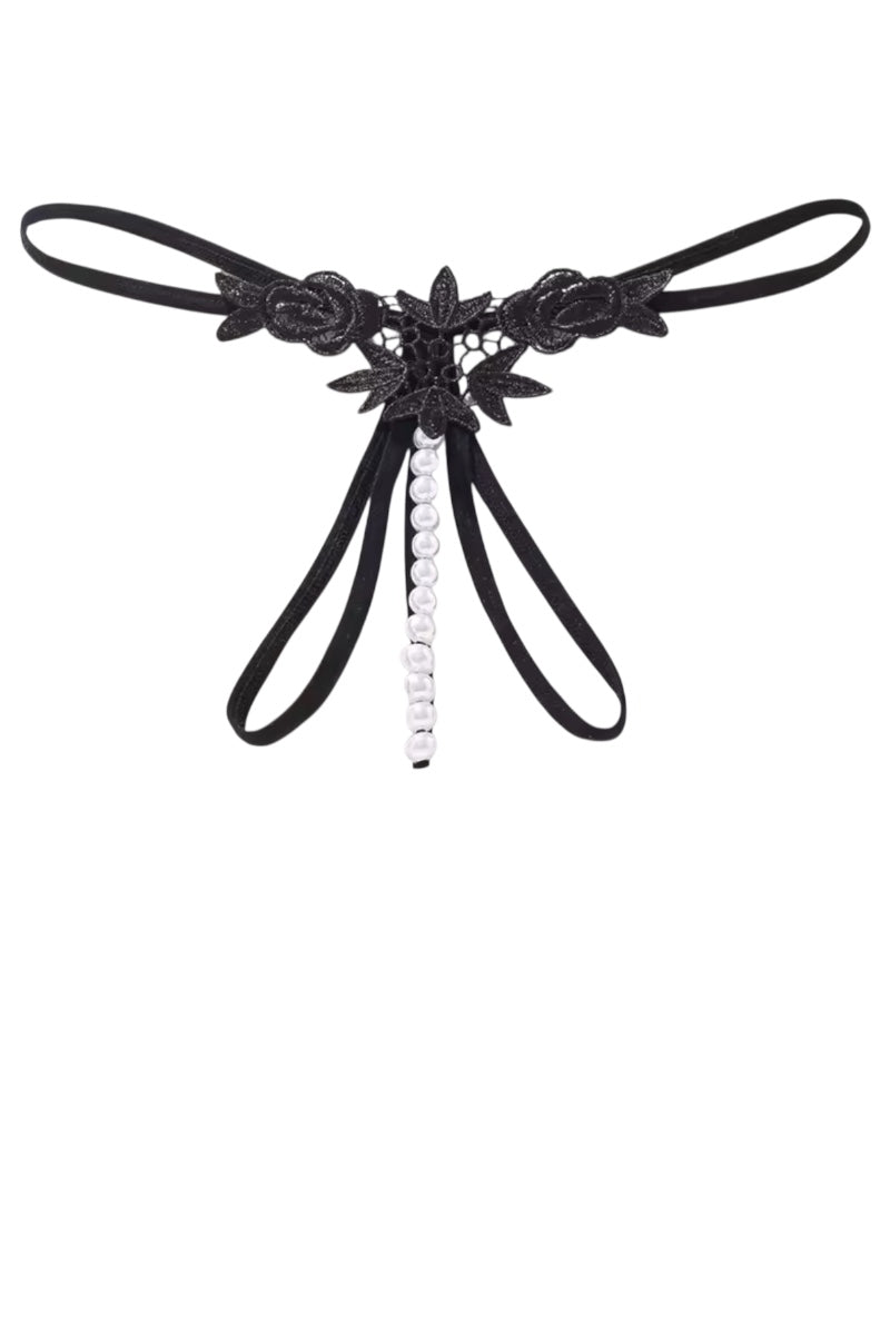 Black lace thong with floral details and a central bead on a white background