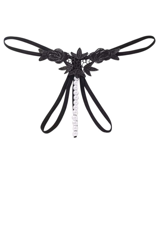Black lace thong with floral details and a central bead on a white background