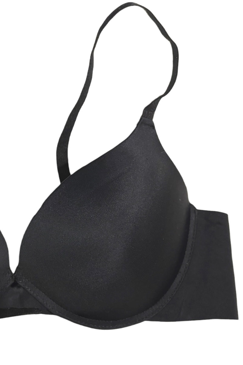 A black wireless underwire bra cup with a wide, supportive band and thin shoulder straps, shown against a plain white background.