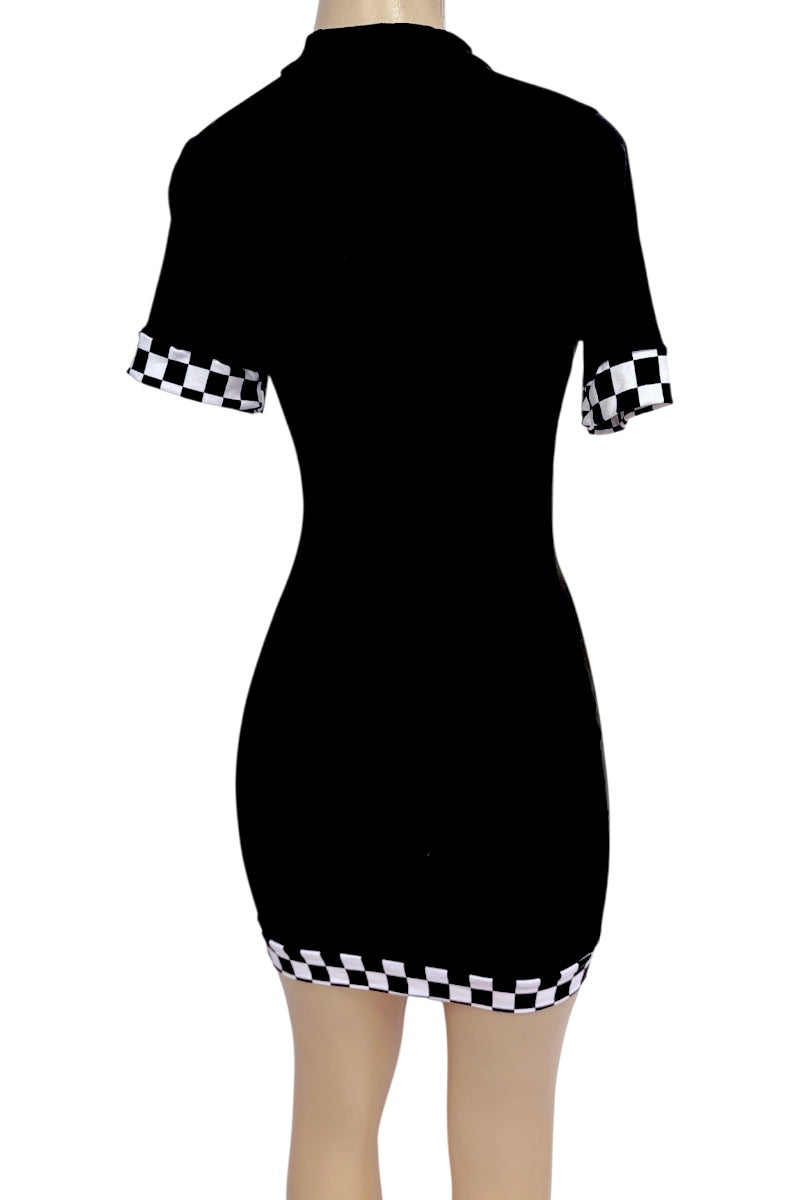 A black short-sleeve bodycon dress shown from the back on a mannequin, featuring black and white checkered trim at the sleeve cuffs and hem.