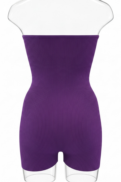 A purple ribbed strapless romper, displayed on a clear mannequin torso against a white background.