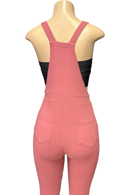 A mannequin torso wearing a pink sleeveless jumpsuit with wide shoulder straps and back pockets, shown against a plain white background.
