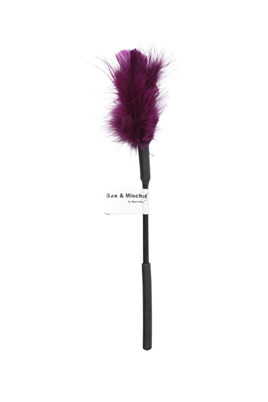 A purple feather duster with a black handle and a white paper tag that reads 'Sex & Mischief', set against a plain white background.
