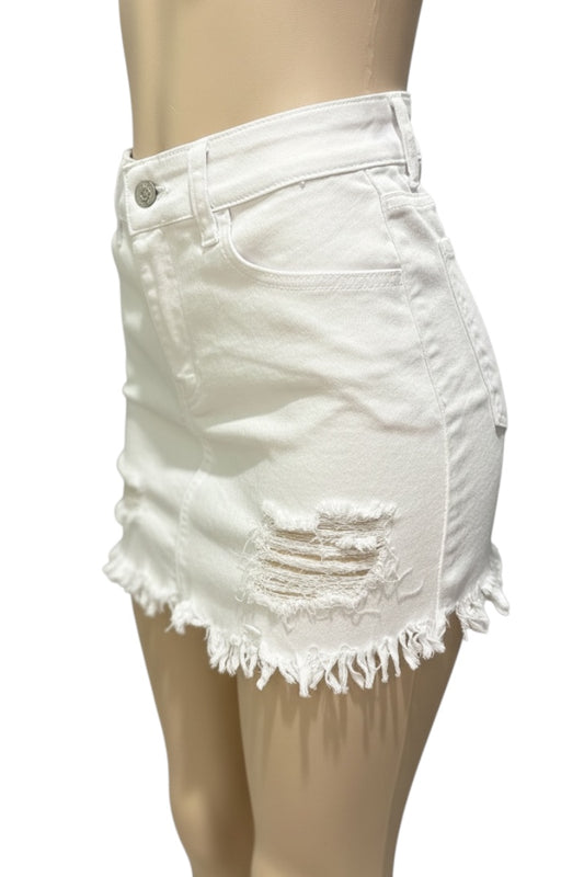 White denim skirt with frayed hem on a mannequin against a white background