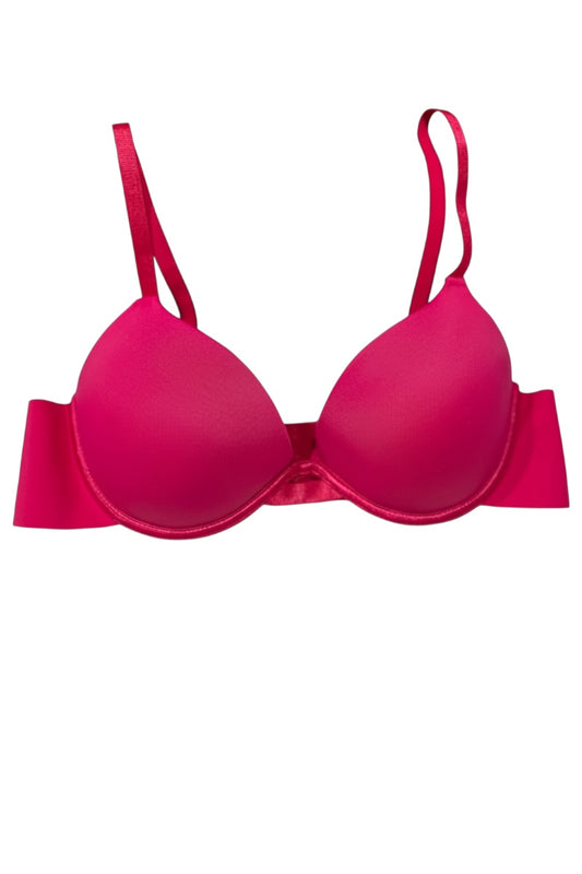 Pink bra on a white background