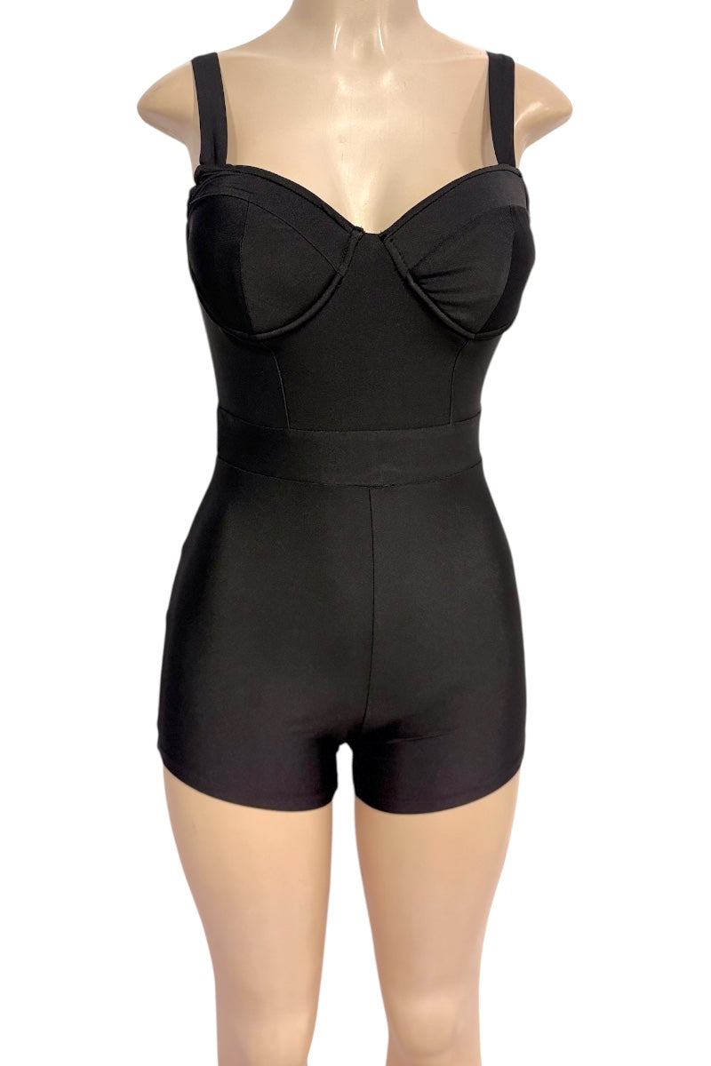 Black romper with cups and built-in shorts, displayed on a mannequin torso against a white background.