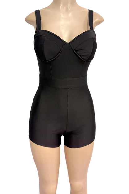 Black romper with cups and built-in shorts, displayed on a mannequin torso against a white background.