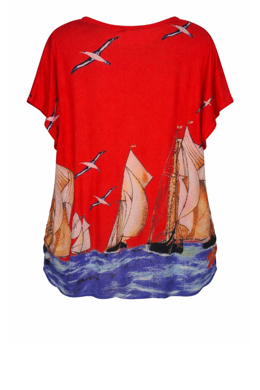 Red shirt with sailboat and seagull design on a white background