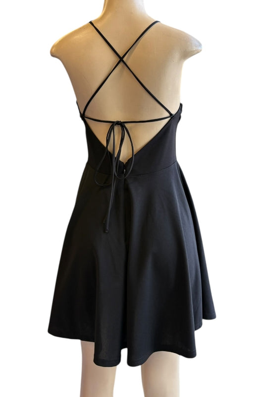 Black dress with criss-cross back on a mannequin against a white background