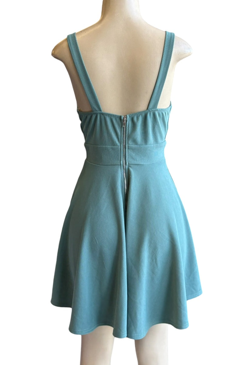 Teal dress on a mannequin with a white background