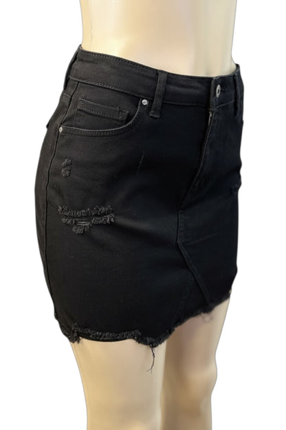 Black denim skirt on a mannequin against a white background