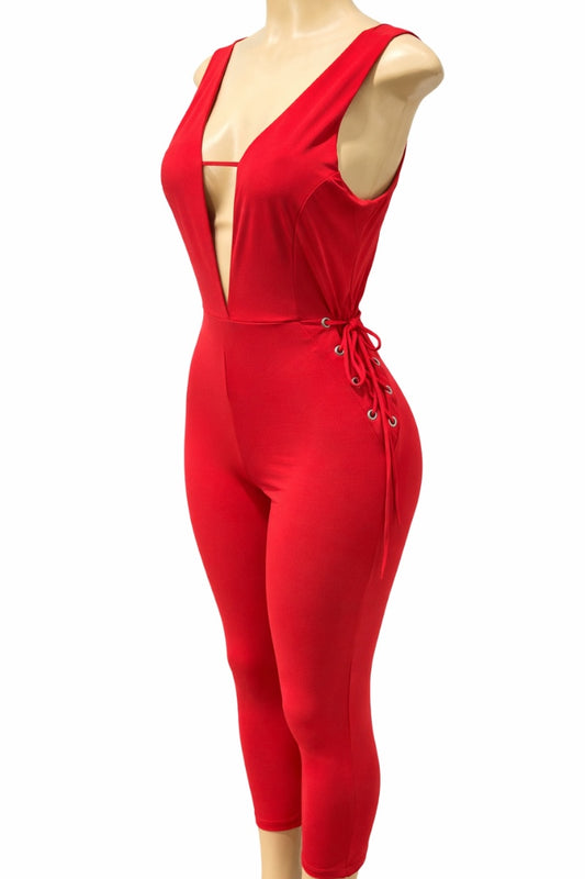 Red jumpsuit on a mannequin against a white background