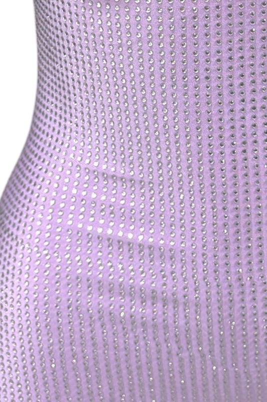 Close-up of a rhinestone lavender fabric with a subtle pattern.