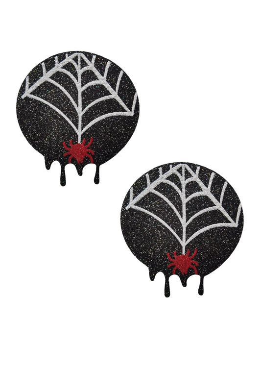 Two black glittery pasties with spider webs and red spiders on a white background