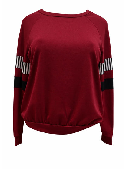 Burgundy sweater with black and white striped sleeves on a white background