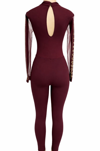 wine jumpsuit with sheer sleeves on a white background