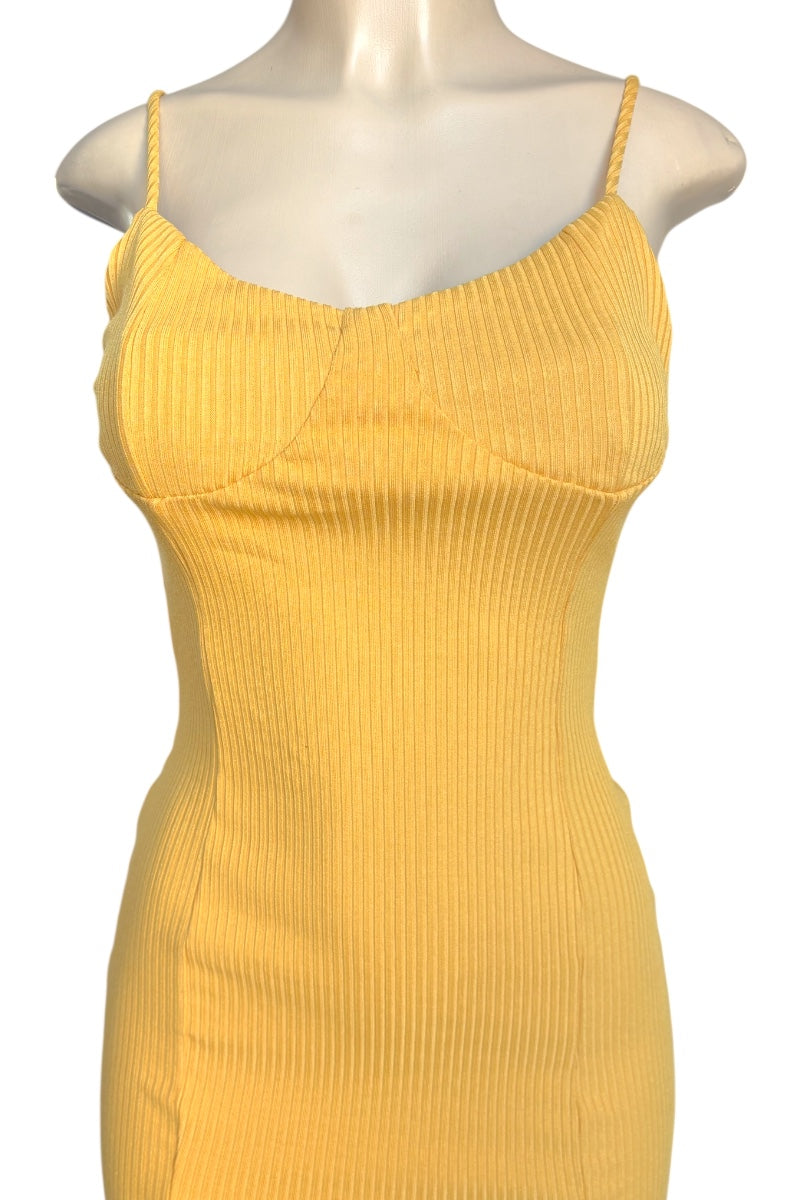 Yellow ribbed dress on a mannequin against a white background
