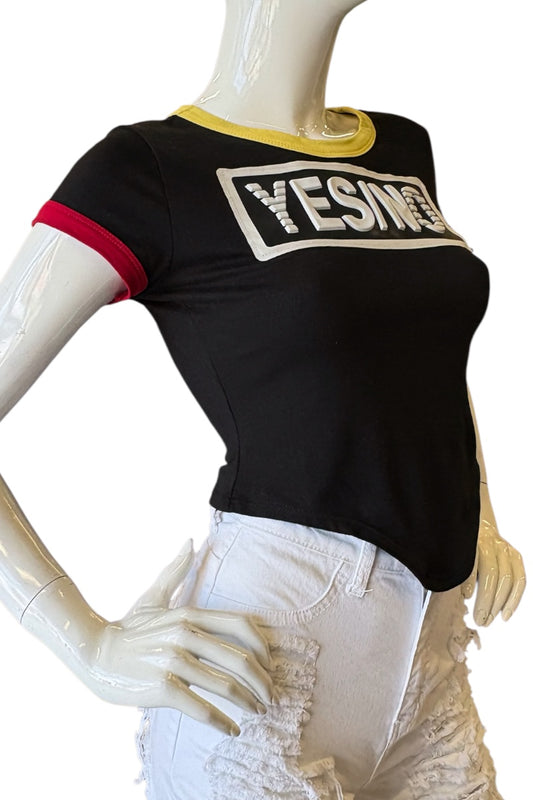 Black t-shirt with 'YES' text on a mannequin against a white background