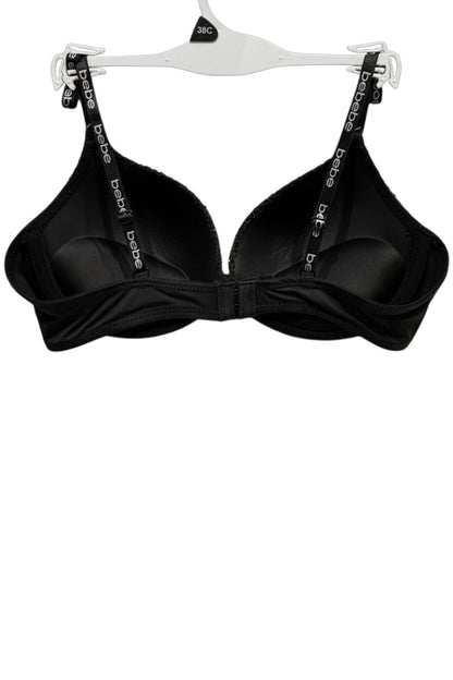 Black bra on a white hanger with visible branding.