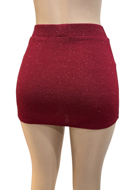 burgundy glittery mini skirt on a mannequin against a white background