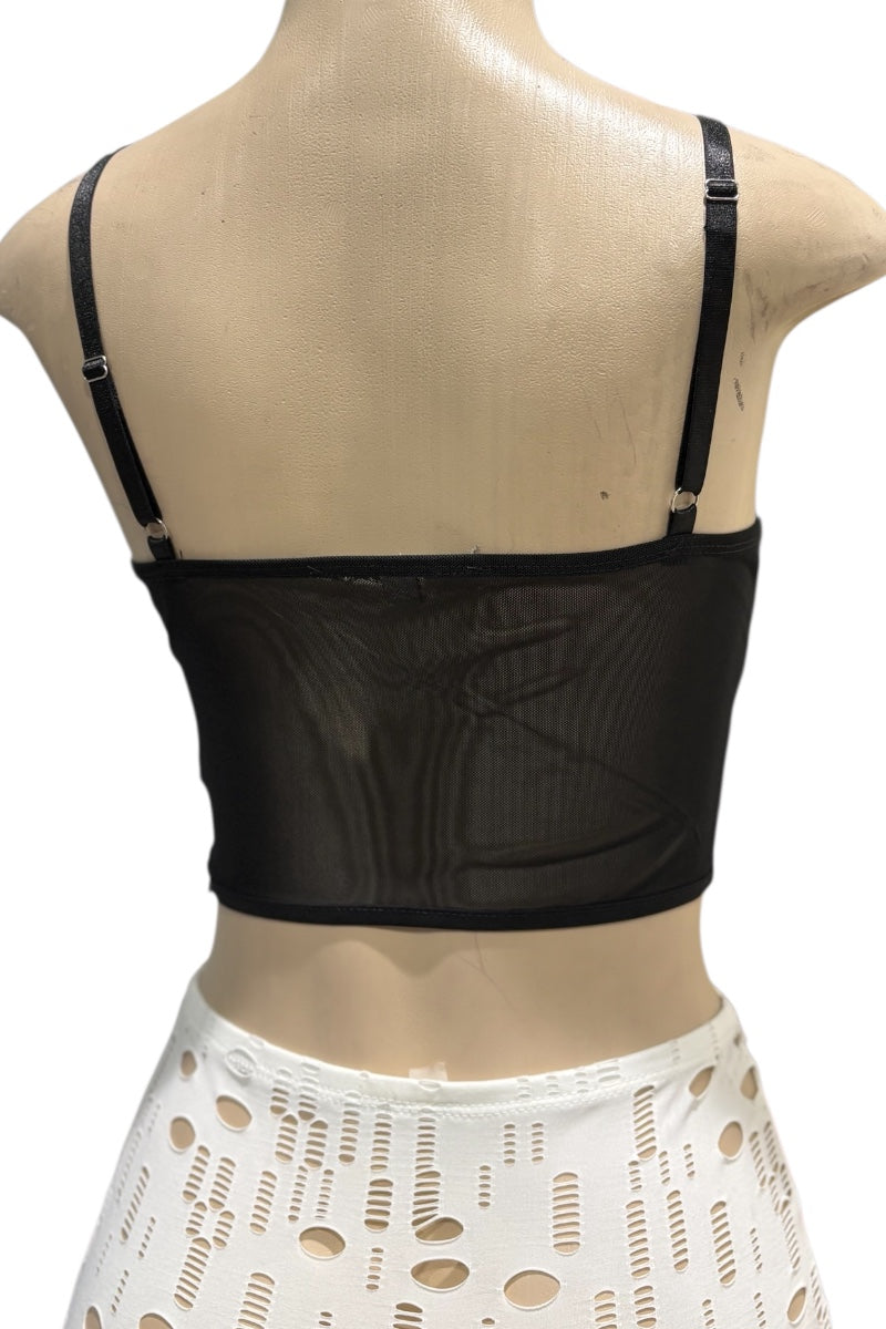 Black crop top on a mannequin with a white background