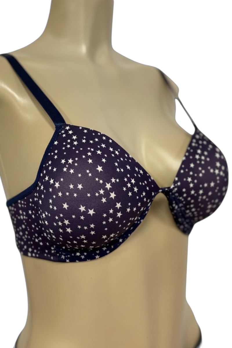 Navy blue bra with star pattern on a mannequin