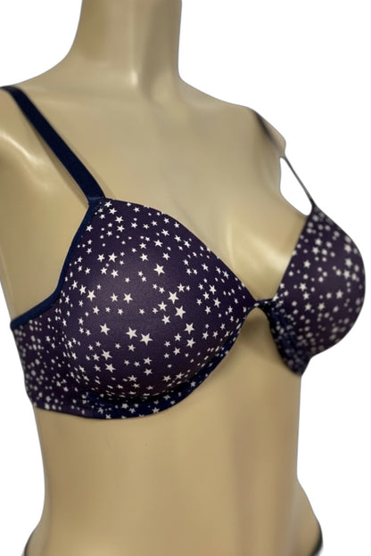 Navy blue bra with star pattern on a mannequin