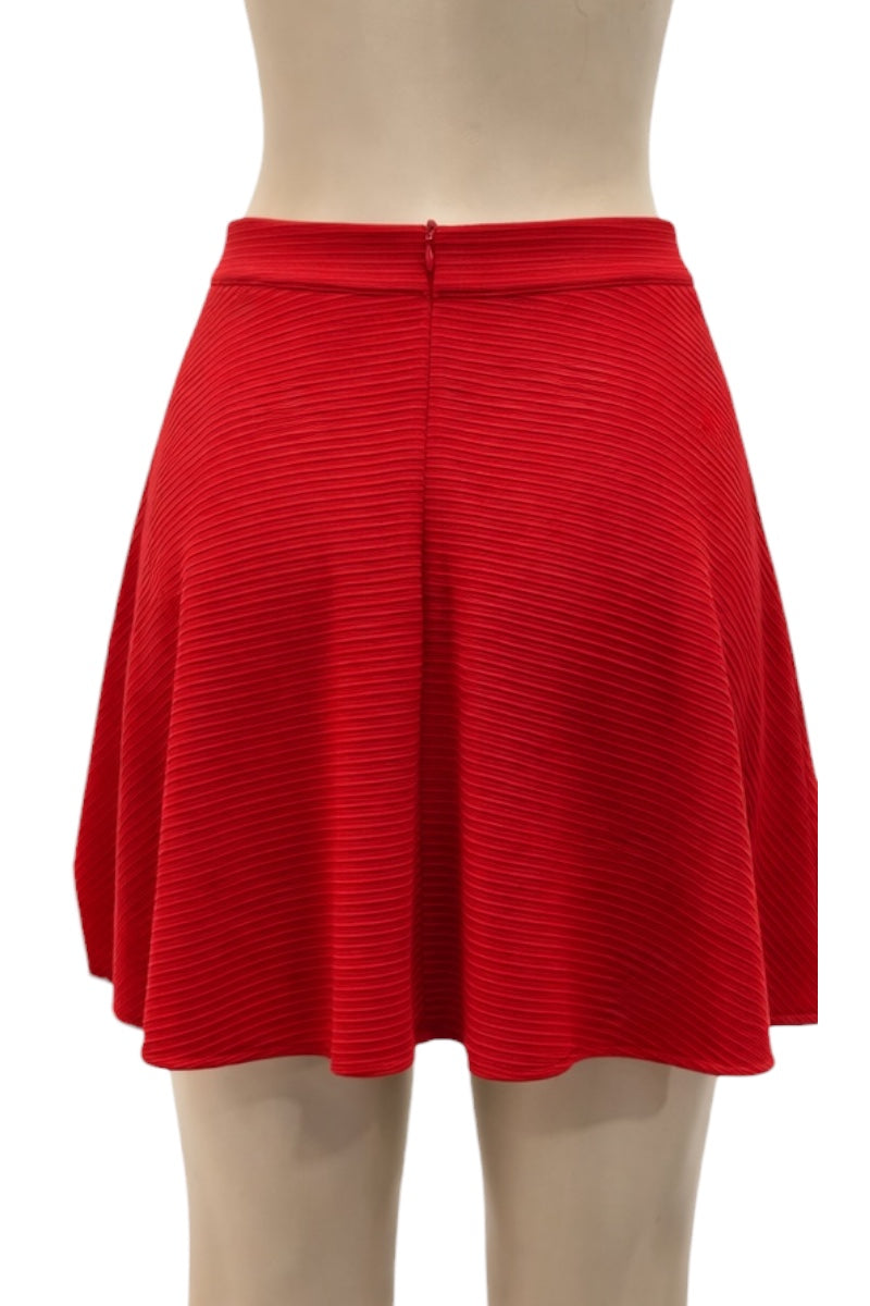 Red skirt on a mannequin against a white background