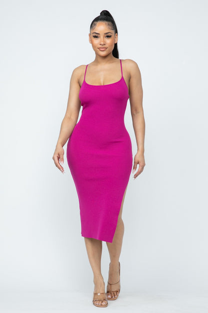 Woman wearing a magenta pink dress on a white background