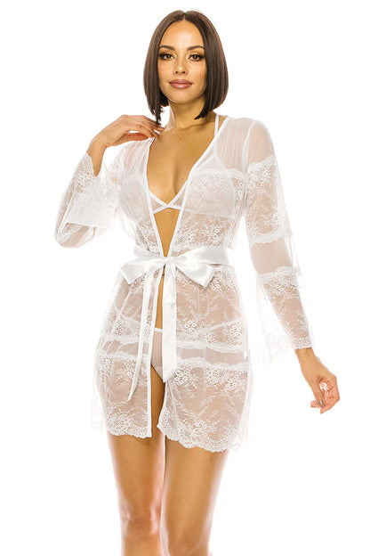 Woman wearing a white lace robe on a white background