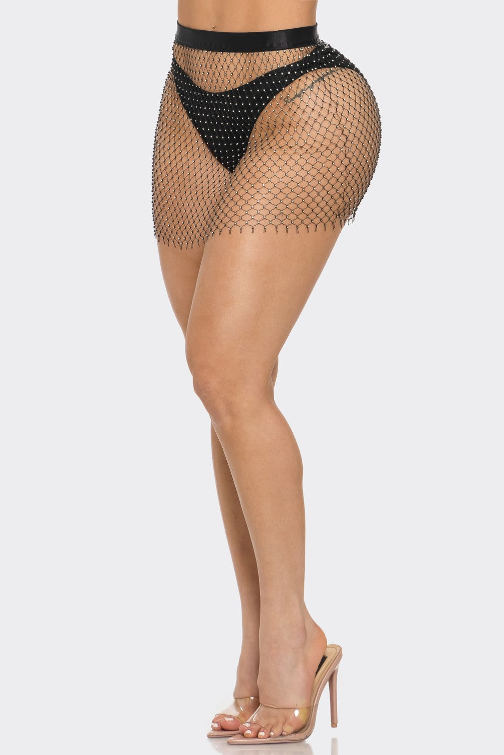 Fishnet skirt with black bottom worn by a model on a white background