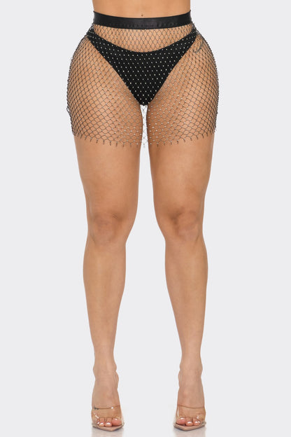 Fishnet skirt with black bottom worn by a model on a white background