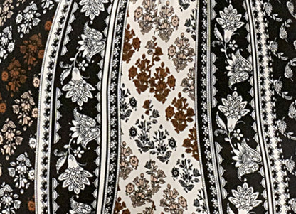 Patterned fabric with floral and stripe designs in black, white, and brown.