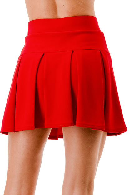 Red skirt worn by a person on a white background