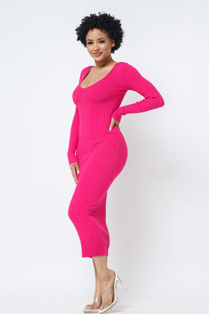 Woman wearing a fuchsia pink ribbed dress on a white background