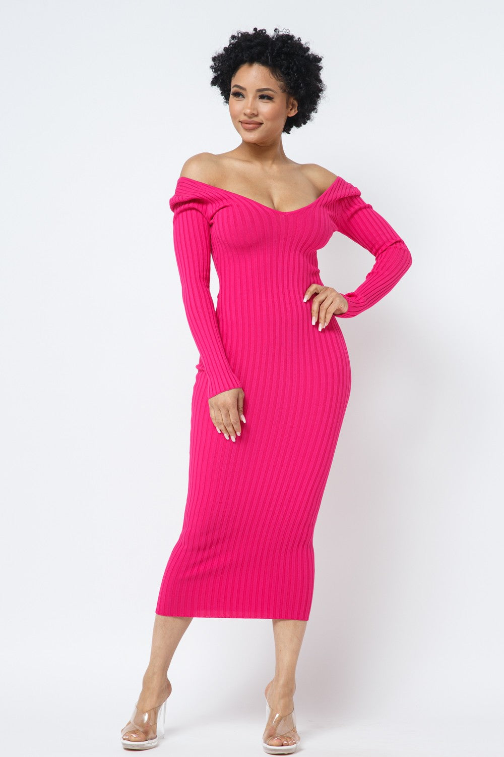 Woman wearing a fuchsia pink off-shoulder dress on a white background