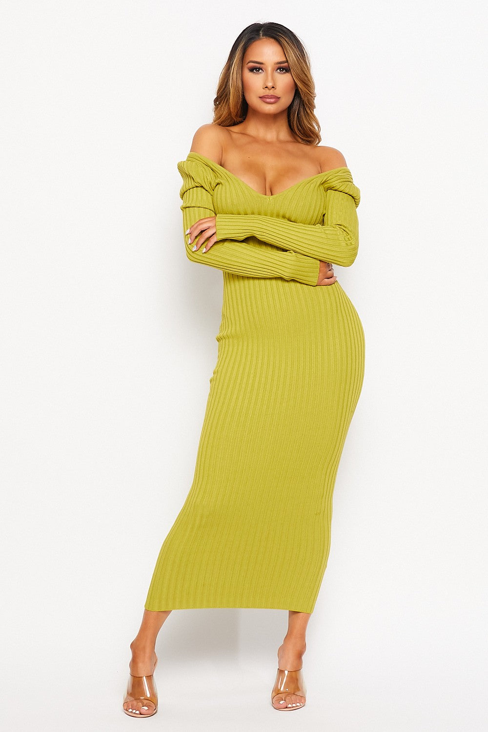 Woman wearing a pistachio green ribbed knit two-piece set on a white background