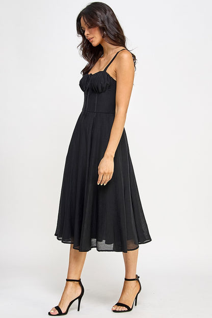 Woman wearing a black dress on a white background