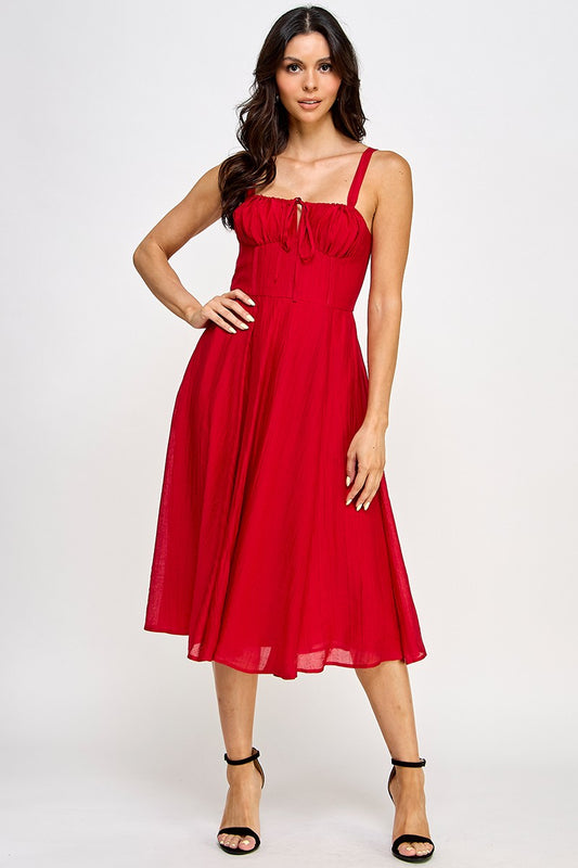 Woman wearing a red dress on a white background