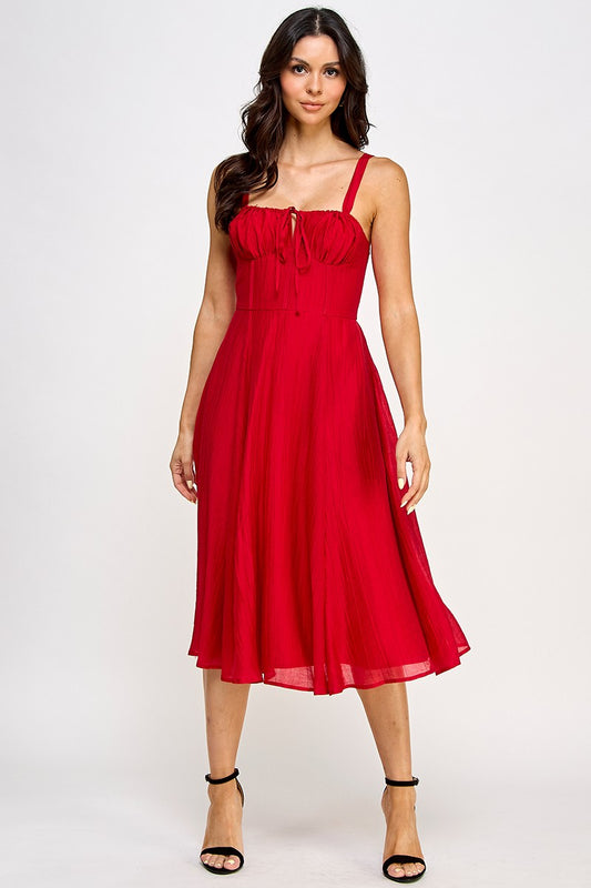 Woman wearing a red dress on a white background