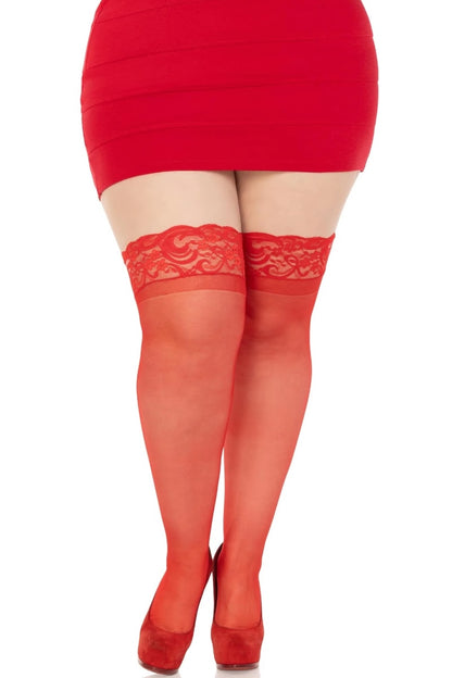 Red lace stockings worn with a red dress on a white background