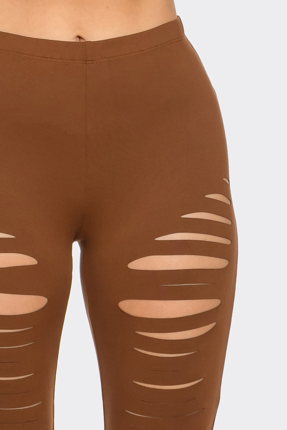 Brown leggings with cut-out design on a light gray background