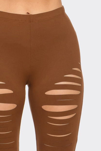 Brown leggings with cut-out design on a light gray background