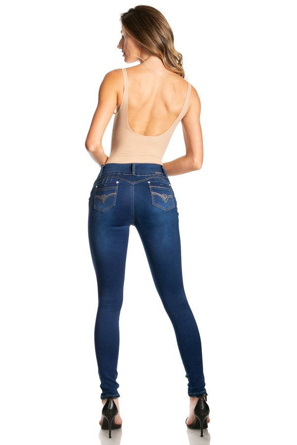Woman wearing blue jeans on a white background
