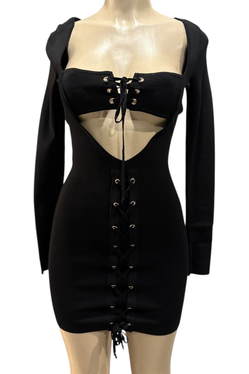 Black dress with long sleeves and lace-up details on a mannequin against a white background