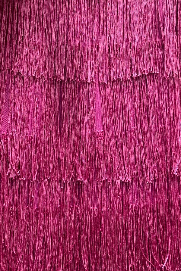 Close-up of purple fabric with fringes